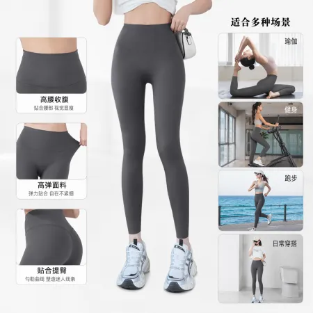 A close-up of the legs of grey high-waisted skinny pants paired with white sports shoes and a small bag A close-up of the legs of grey high-waisted skinny pants paired with white sports shoes and a small bag